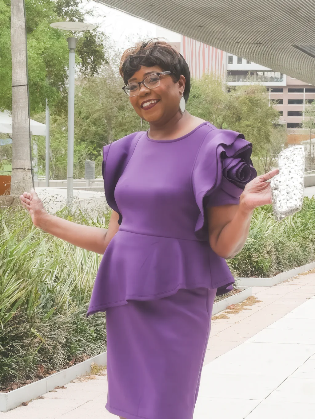 65th birthday portrait with a natural smile along the Riverwalk