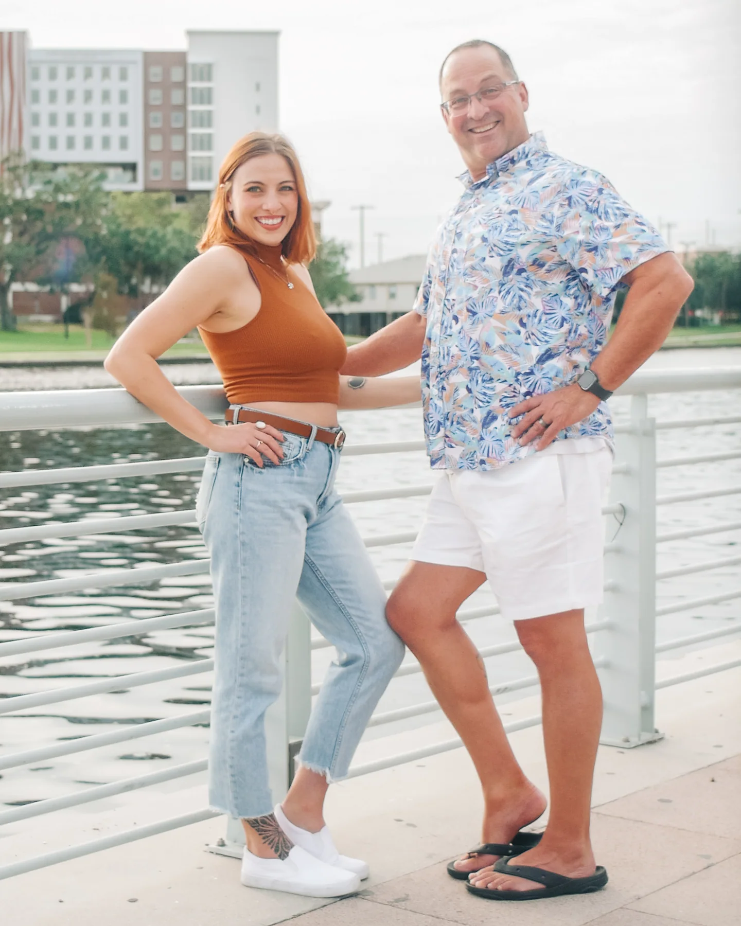 Father and daughter posing together beside the Tampa waterfront