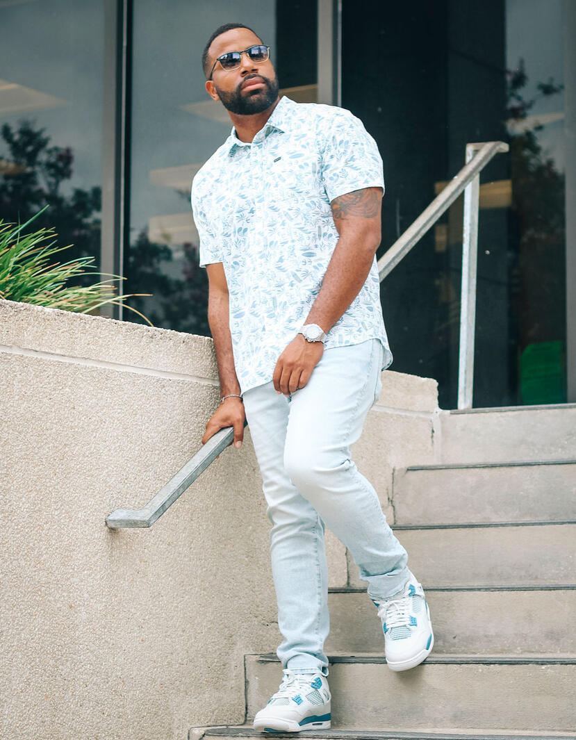 Man walking down library stairs