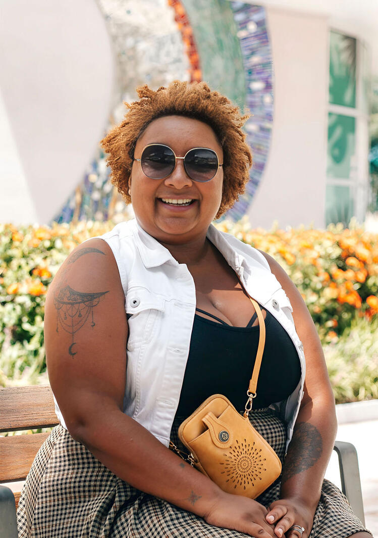 Woman sitting on bench at Curtis Hixon Park