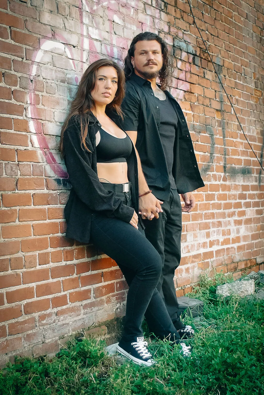 Couple photographed against Ybor brick architecture